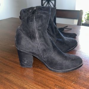 Knee high black heeled boots